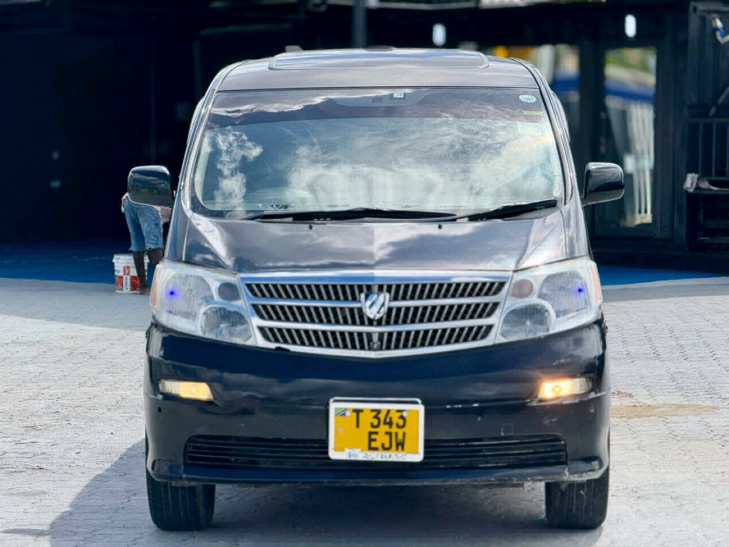 Black Toyota Alphard Minivan (Reg No. EJW)