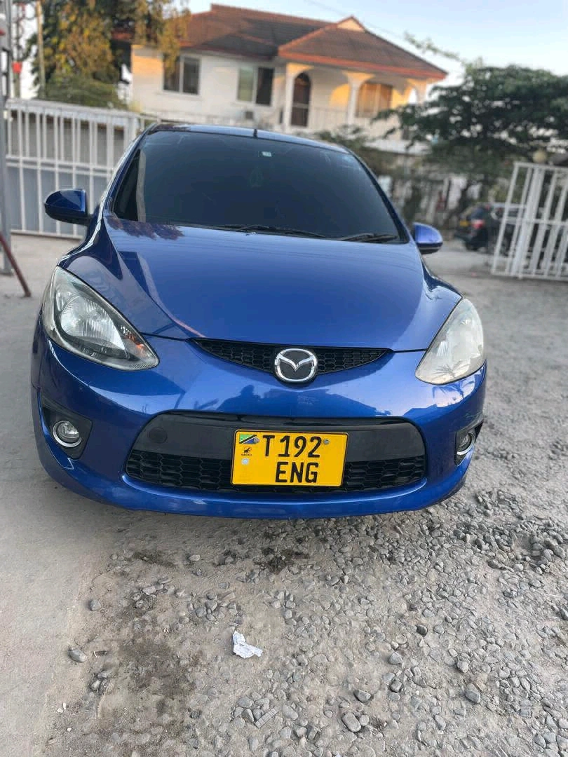 Blue Mazda Demio Car