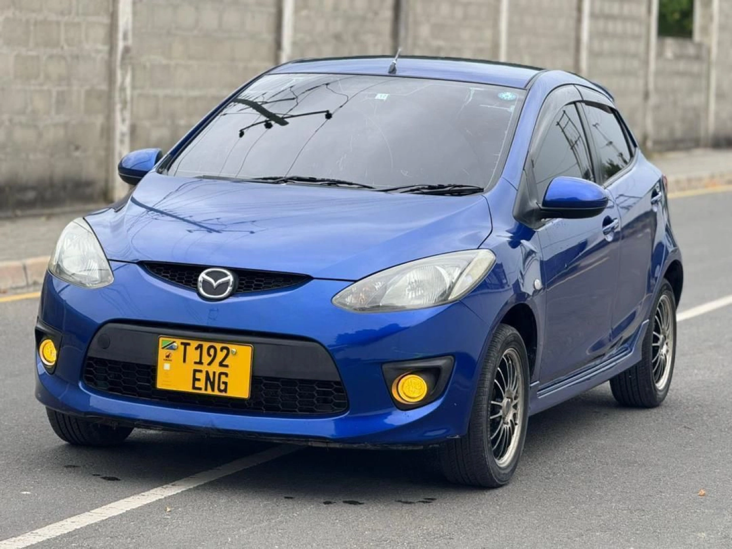 Blue Mazda Demio Hatchback with Sports Rims
