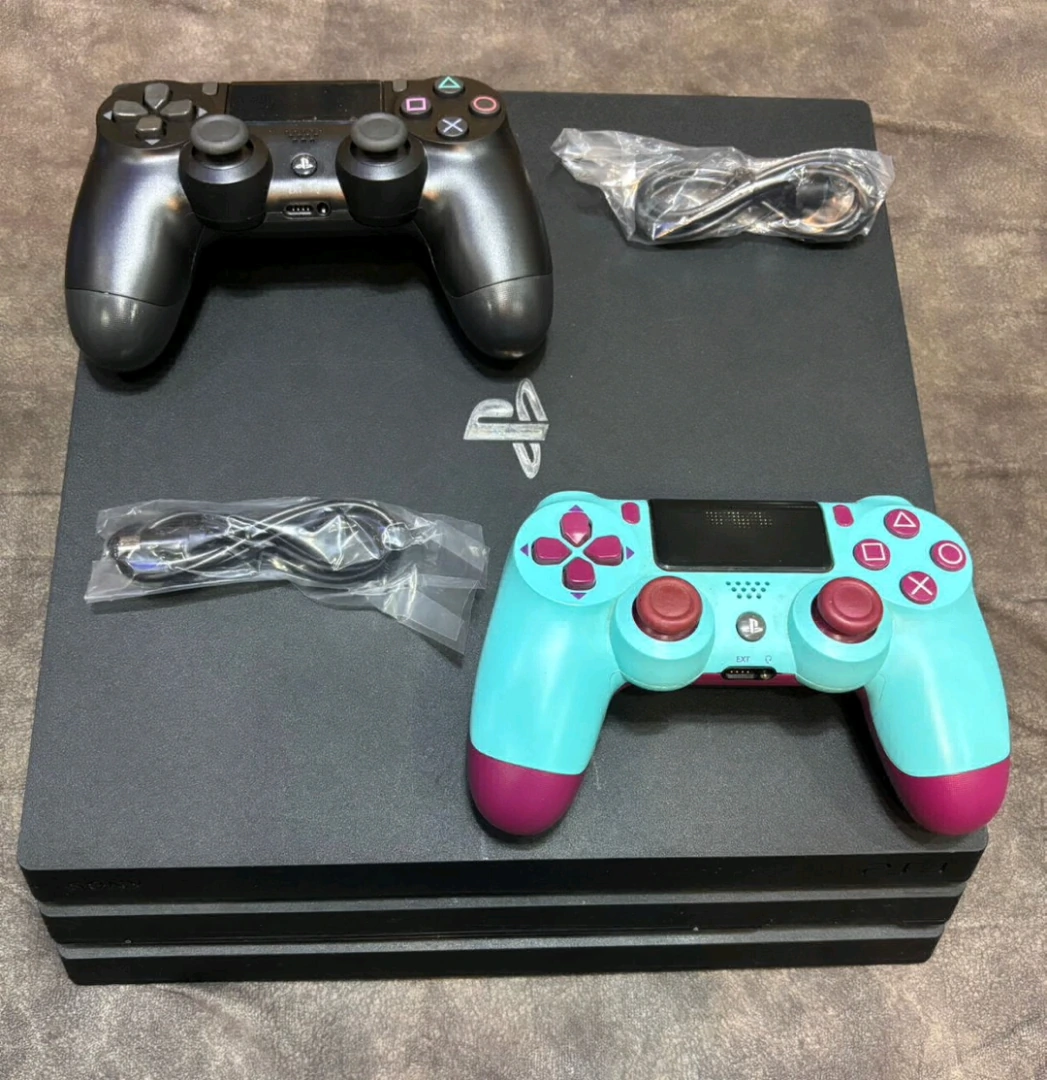 Sony PlayStation 4 Pro 1TB Console with 2 Controllers & 7 Games