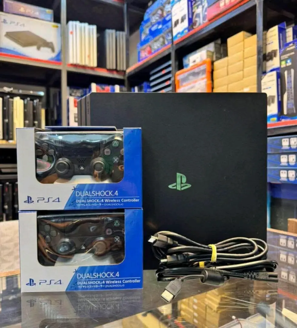 PlayStation 4 (PS4) with 2 Controllers & 16 Games
