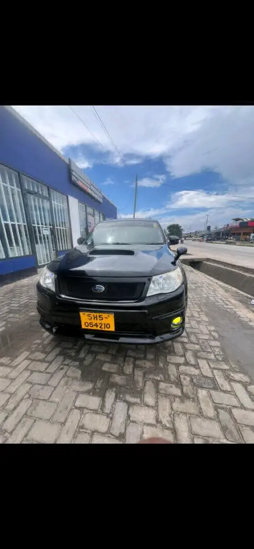 Subaru Forester 2010 Nyeusi na Android Radio